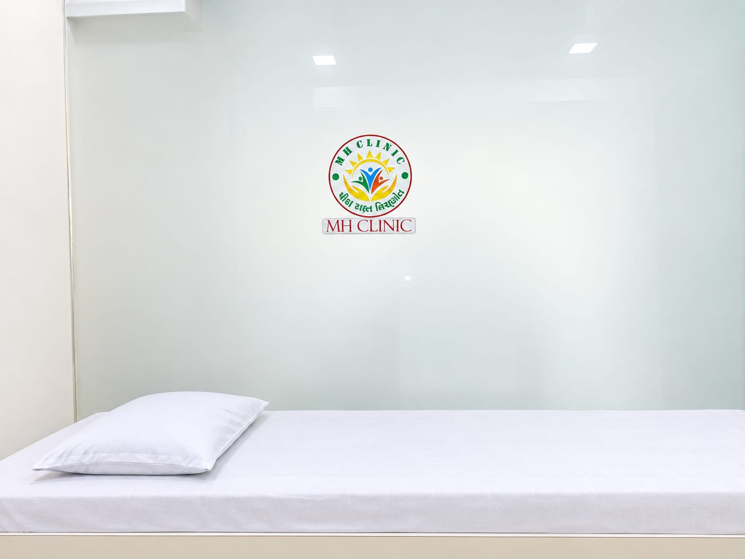 MH CLINIC reception desk with warm pendant light